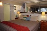 The main bedroom (on the second floor) is designed with communication and style as main targets. The unique open plan bathroom and walk-in wardrobe serve this purpose well while the timber floors and artistic coconut finishes complement the general house theme of earthliness The main bedroom (on the second floor) is designed with communication and style as main targets. The unique open plan bathroom and walk-in wardrobe serve this purpose well while the timber floors and artistic coconut finishes complement the general house theme of earthliness